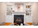 Inviting living room highlighting a fireplace with built-in bookshelves and stylish decor at 7713 Summercrest Dr, Apex, NC 27539