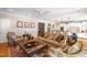 Spacious living room with hardwood flooring, area rug, and comfortable seating at 7713 Summercrest Dr, Apex, NC 27539