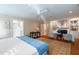 Open main bedroom featuring hardwood floors, a fireplace, and an en-suite bathroom for ultimate comfort at 7713 Summercrest Dr, Apex, NC 27539