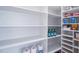 Spacious pantry with multiple shelves, providing ample storage space at 7713 Summercrest Dr, Apex, NC 27539