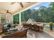 Spacious covered back patio featuring ample seating and dining areas overlooking the yard at 7713 Summercrest Dr, Apex, NC 27539