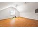 Bright, large bonus room featuring wood floors, window, and two closets at 7713 Summercrest Dr, Apex, NC 27539