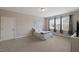 Bright bedroom with large windows, light-colored walls, and plenty of space for relaxation at 824 Stanly House St, Wake Forest, NC 27587