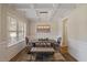Bright dining room showcases wainscoting, a unique chandelier, and a cozy bench seating arrangement at 824 Stanly House St, Wake Forest, NC 27587