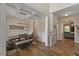 Elegant dining area features coffered ceilings, wainscoting, and a stylish chandelier above the table at 824 Stanly House St, Wake Forest, NC 27587