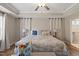 Bright and airy main bedroom with a tray ceiling and an ensuite bathroom at 824 Stanly House St, Wake Forest, NC 27587