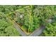 Aerial shot of property with estimated property lines, showcasing the wooded area and home placement at 908 Cedar Fork Trl, Chapel Hill, NC 27514