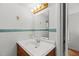 A vintage style bathroom with a tiled wall and vanity at 908 Cedar Fork Trl, Chapel Hill, NC 27514