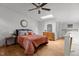Bright bedroom with a skylight, wooden floors, and a ceiling fan at 908 Cedar Fork Trl, Chapel Hill, NC 27514