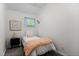 Comfortable bedroom with a plush bed, a nightstand, and neutral decor at 908 Cedar Fork Trl, Chapel Hill, NC 27514