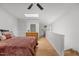 Bright bedroom with skylight, wood floor, and laundry machines in the background at 908 Cedar Fork Trl, Chapel Hill, NC 27514