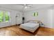 Tranquil bedroom with hardwood floors, a modern platform bed, and abundant natural light at 908 Cedar Fork Trl, Chapel Hill, NC 27514