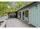Inviting deck with sliding glass doors, comfortable seating and outdoor furnishings; perfect for relaxing at 908 Cedar Fork Trl, Chapel Hill, NC 27514