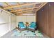 Comfortable seating area on the deck with wicker chairs, accent rug, and string lighting overhead at 908 Cedar Fork Trl, Chapel Hill, NC 27514