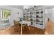 Dining area featuring a bookshelf and view to the outside at 908 Cedar Fork Trl, Chapel Hill, NC 27514