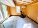 Inside the outbuilding with wood paneling and a small air conditioner at 908 Cedar Fork Trl, Chapel Hill, NC 27514