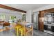 Bright kitchen with stainless appliances, an island with seating, and an open floor plan at 908 Cedar Fork Trl, Chapel Hill, NC 27514