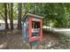 Charming Little Free Library box featuring an assortment of books, promoting literacy and community engagement at 908 Cedar Fork Trl, Chapel Hill, NC 27514