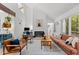 Bright living area with fireplace, built-ins, and access to the outdoors at 908 Cedar Fork Trl, Chapel Hill, NC 27514