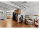 Living room featuring hardwood floors, kitchen, exposed beams, and a ceiling fan at 908 Cedar Fork Trl, Chapel Hill, NC 27514