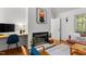 Cozy living area with fireplace, workspace, and natural light at 908 Cedar Fork Trl, Chapel Hill, NC 27514