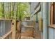 Enclosed outdoor shower featuring wooden accents and metal siding, surrounded by trees at 908 Cedar Fork Trl, Chapel Hill, NC 27514