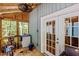 Cozy screened porch with wood floors, walls, and a ceiling fan at 908 Cedar Fork Trl, Chapel Hill, NC 27514