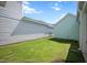 Backyard features a well-maintained lawn and view of the house's exterior, offering a serene outdoor space at 979 Branch Line Ln, Apex, NC 27502