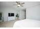 Spacious carpeted bedroom featuring a ceiling fan, dresser, and closet at 979 Branch Line Ln, Apex, NC 27502