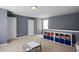 Bonus room with neutral carpet, gray walls, shelving and a small table with chairs, with two entries at 979 Branch Line Ln, Apex, NC 27502