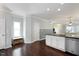 View of kitchen including breakfast nook, with white cabinets and stainless steel appliances at 979 Branch Line Ln, Apex, NC 27502