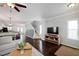 Bright living room features hardwood floors, a comfortable sectional sofa, and an open concept design at 979 Branch Line Ln, Apex, NC 27502