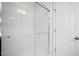 Bathroom with white subway tile shower, glass door, and white door at 979 Branch Line Ln, Apex, NC 27502