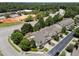 Aerial view of townhomes, showcasing the neighborhood's layout, landscaping, and proximity to amenities at 103 Aisling Ct, Cary, NC 27513