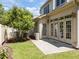 Well-maintained backyard featuring a patio, lush lawn, and mature tree at 103 Aisling Ct, Cary, NC 27513