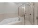 Bathroom with a tiled shower and a jacuzzi tub at 103 Aisling Ct, Cary, NC 27513