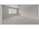 Bright bedroom with plush carpeting, neutral paint and plantation shutters offering great natural light at 103 Aisling Ct, Cary, NC 27513