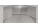 Expansive carpeted bonus room with neutral paint, ceiling fan, and ample open space at 103 Aisling Ct, Cary, NC 27513