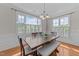 Bright dining room with wainscoting and large windows that provide natural light at 103 Aisling Ct, Cary, NC 27513