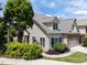 Beautiful home exterior featuring mature trees, manicured shrubbery and architectural design details at 103 Aisling Ct, Cary, NC 27513