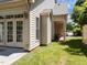 Charming home exterior with light siding, double glass doors, and a covered porch at 103 Aisling Ct, Cary, NC 27513