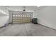 Spacious two car garage with neutral paint and automatic door at 103 Aisling Ct, Cary, NC 27513