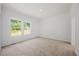 Bedroom with carpet flooring and large windows at 1065 Shuford Rd, Wake Forest, NC 27587
