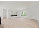 Spacious living room with wood-look floors and natural light at 1065 Shuford Rd, Wake Forest, NC 27587