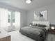 Serene main bedroom featuring a plush bed, soft lighting, and large windows at 1065 Shuford Rd, Wake Forest, NC 27587