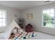 Bright bedroom features a teepee, cozy seating, and plenty of room for play at 1103 Mallory Ln, Durham, NC 27713