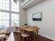 Bright dining area featuring a modern wooden table and chairs, perfect for Gathering meals and gatherings at 1103 Mallory Ln, Durham, NC 27713
