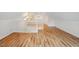 Large attic featuring wood floors, high ceilings, and white banister at 1120 Colonial Club Rd, Wake Forest, NC 27587