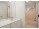 Bright bathroom featuring white cabinets, a sleek mirror, and a separate toilet and shower area at 1120 Colonial Club Rd, Wake Forest, NC 27587