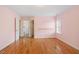 The bedroom is spacious, featuring hardwood floors and is freshly painted with easy access to an adjacent bathroom at 1120 Colonial Club Rd, Wake Forest, NC 27587